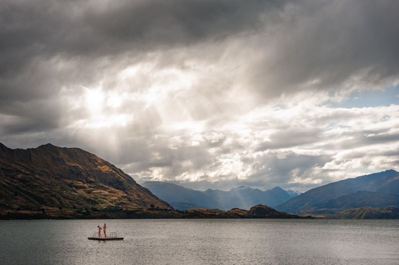 Dramatic and moody sky over Lake Wanaka in New Zealand, with ominous clouds gathering over the water