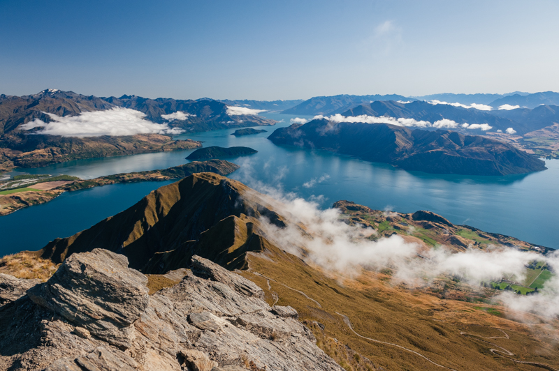 Summit of Roy’s Peak, overlooking a breathtaking mountain range in New Zealand